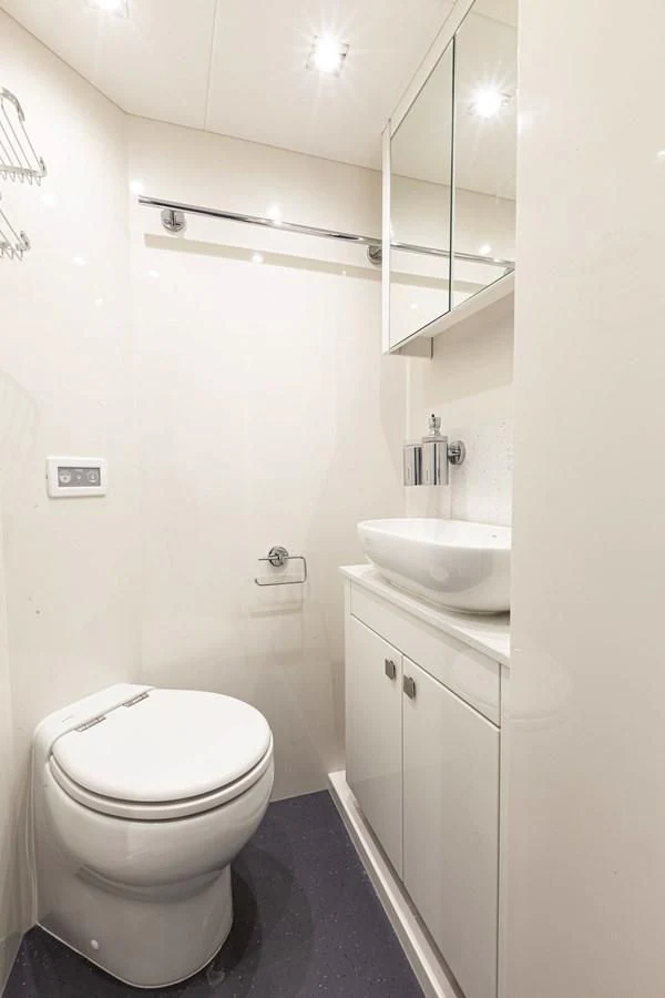 a bathroom with a sink and toilet aboard NEW EDGE Yacht for Sale