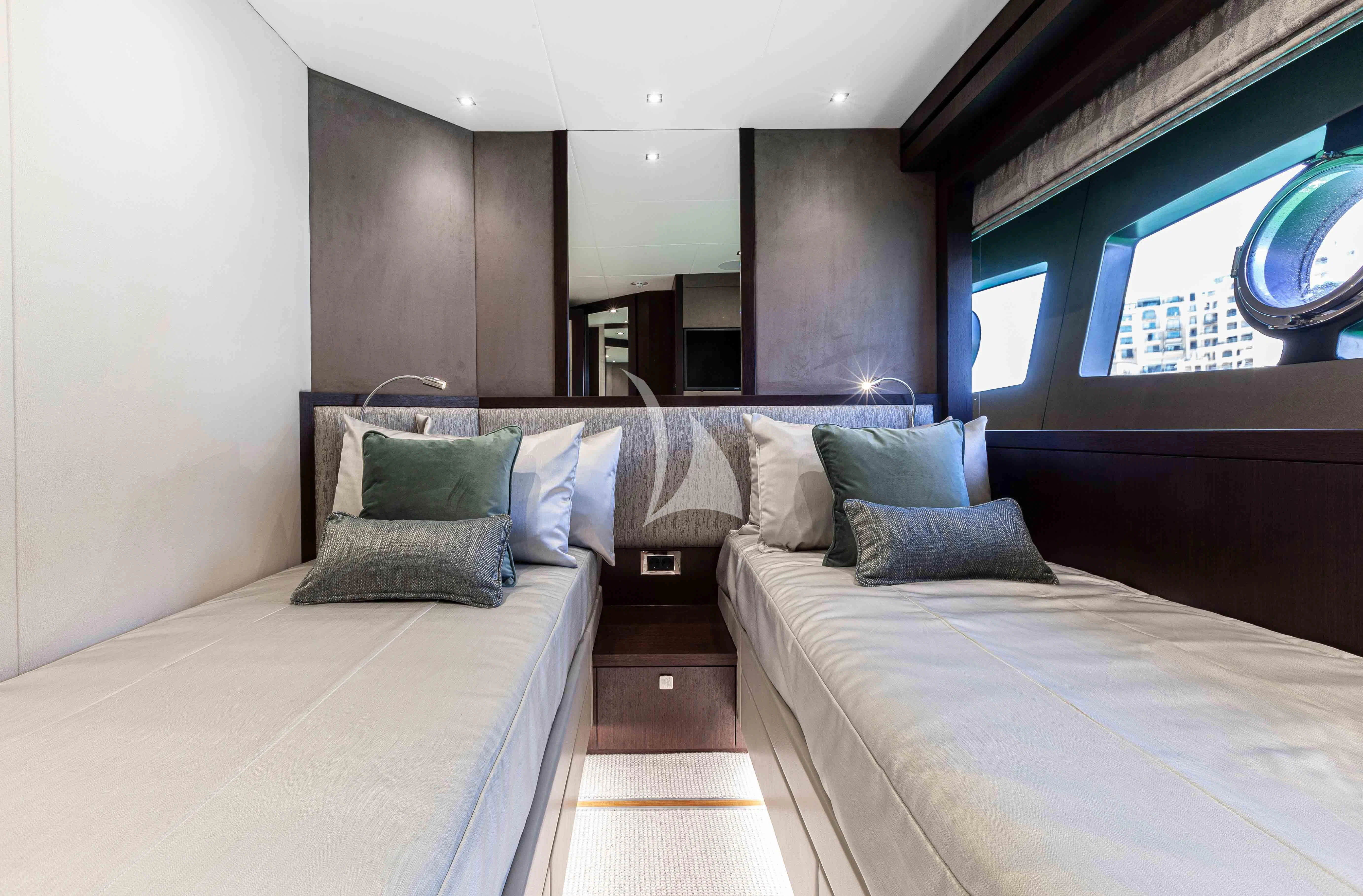 a room with a bed and a couch aboard NEW EDGE Yacht for Sale