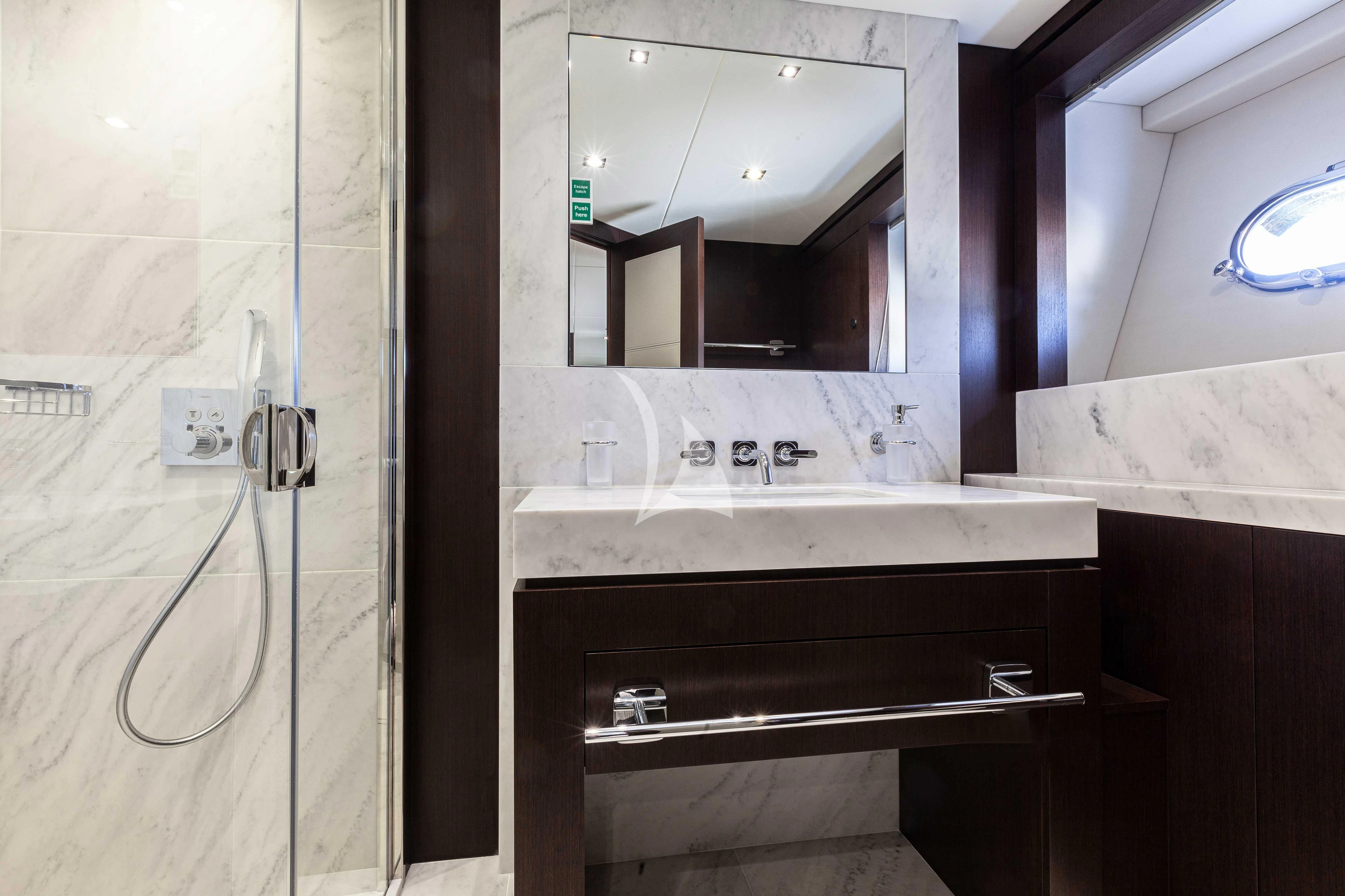 a bathroom with a sink and a mirror aboard NEW EDGE Yacht for Sale