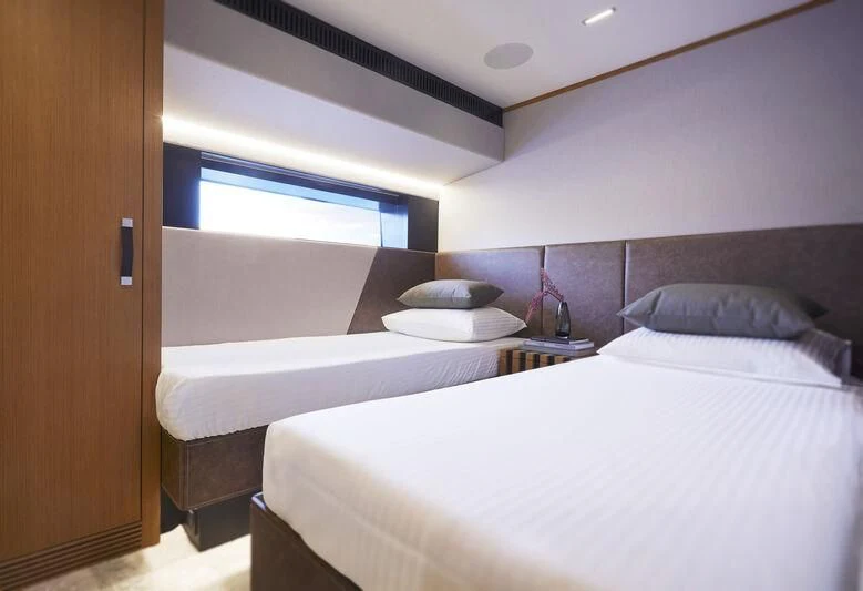 a room with a couple of beds aboard BLUE JEANS Yacht for Sale