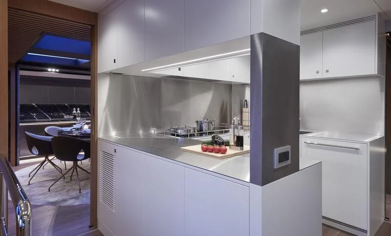 a kitchen with white cabinets aboard BLUE JEANS Yacht for Sale