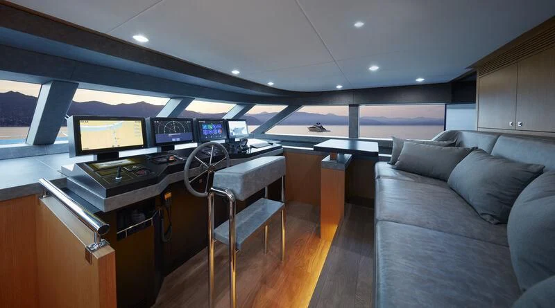 a room with a couch and a desk with a computer on it aboard BLUE JEANS Yacht for Sale