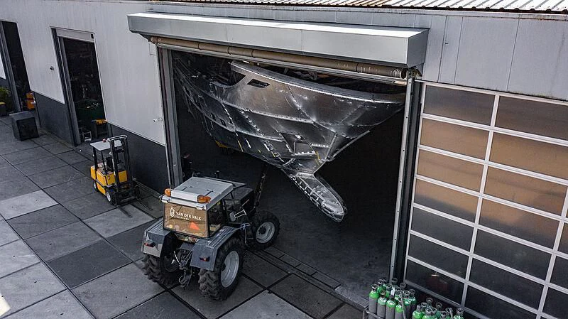 a large metal trailer with a large metal object on it aboard BLUE JEANS Yacht for Sale