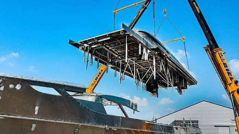 a large crane on a building aboard BLUE JEANS Yacht for Sale
