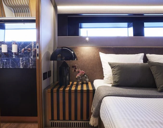a room with a bed and a window aboard BLUE JEANS Yacht for Sale