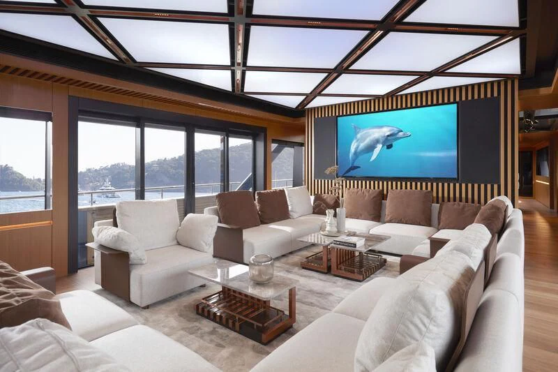 a living room with a large screen aboard BLUE JEANS Yacht for Sale