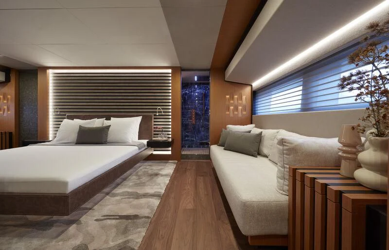 a room with a bed and a table aboard BLUE JEANS Yacht for Sale