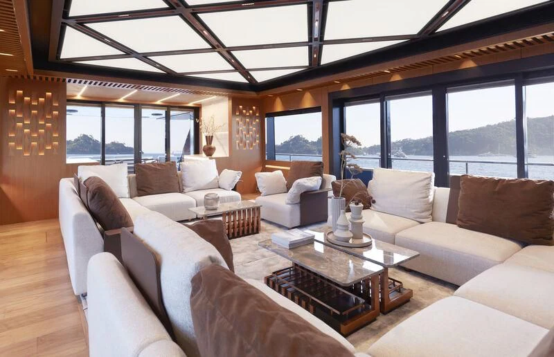 a living room with a large window aboard BLUE JEANS Yacht for Sale