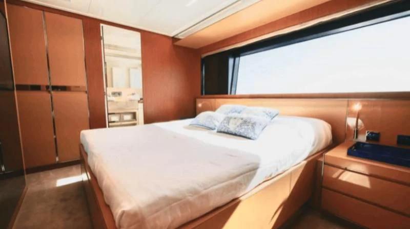 a bed in a room aboard BASILIC Yacht for Sale