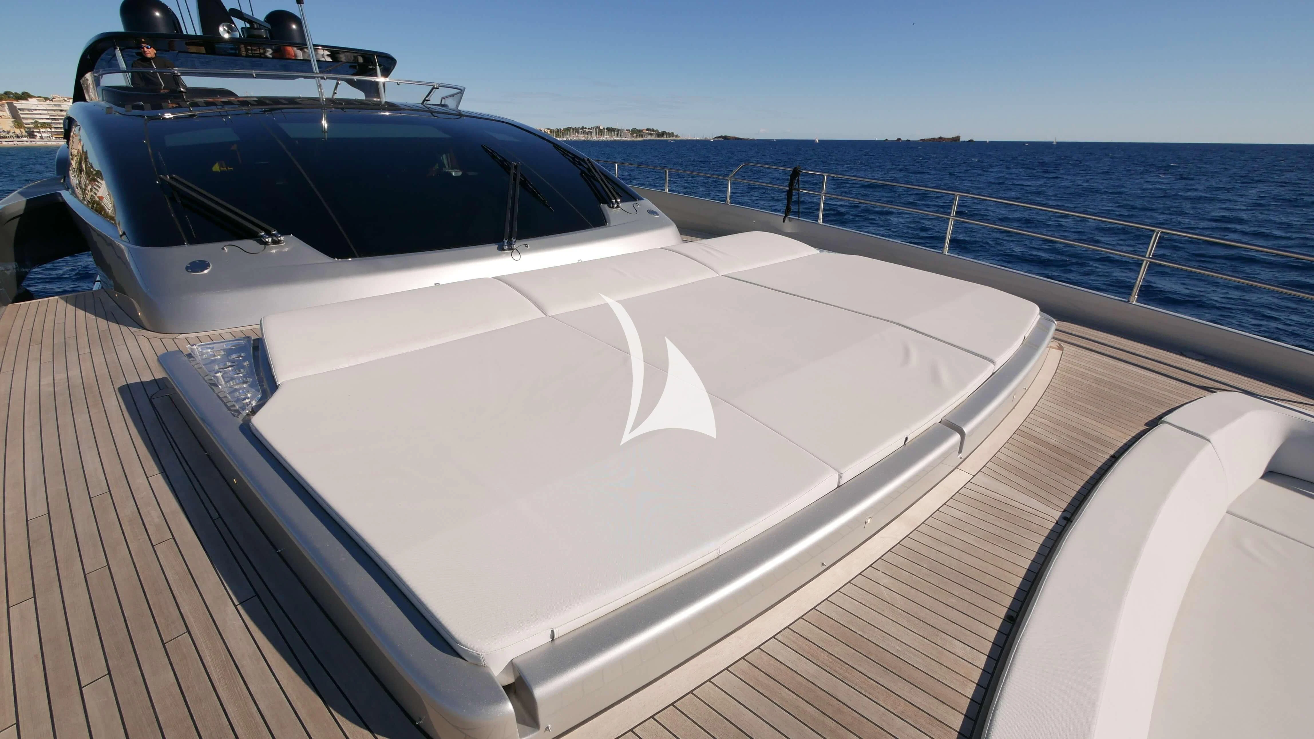 a white boat on a deck aboard BASILIC Yacht for Sale