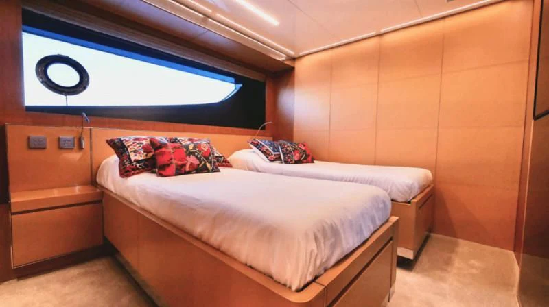 a room with two beds aboard BASILIC Yacht for Sale