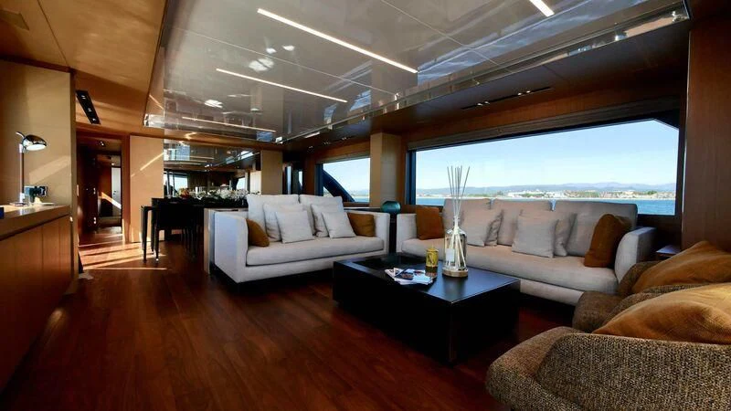 a living room with a large window aboard BASILIC Yacht for Sale