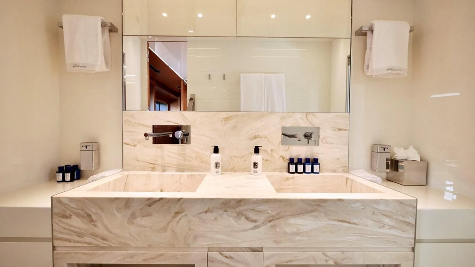 a bathroom with a large mirror aboard BASILIC Yacht for Sale