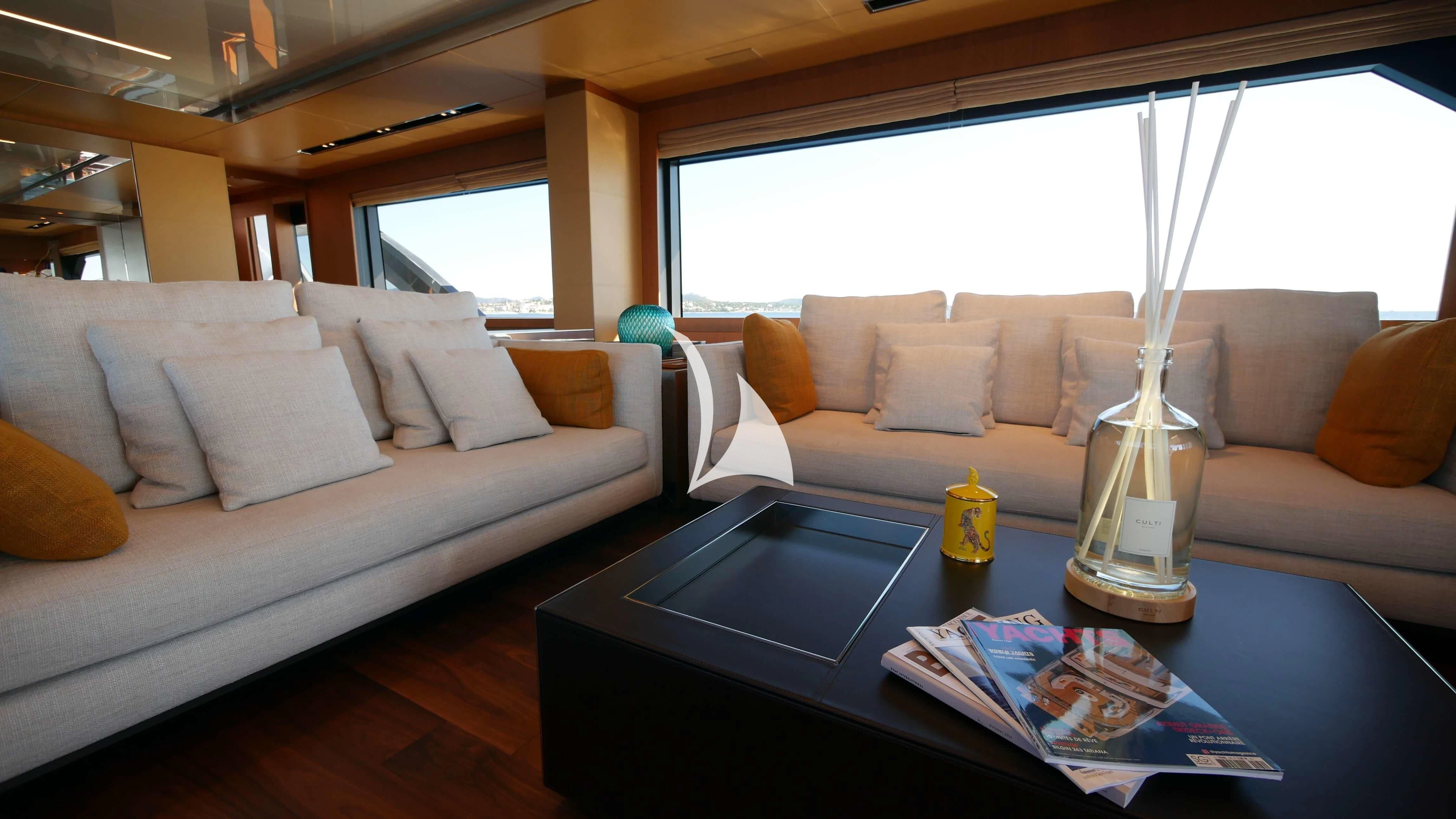 a glass of water on a table aboard BASILIC Yacht for Sale