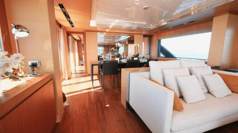 a room with a couch and a table aboard BASILIC Yacht for Sale