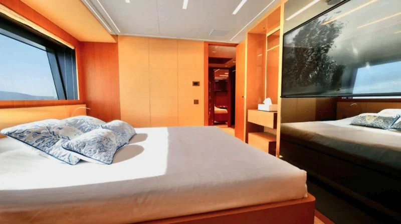 a room with two beds aboard BASILIC Yacht for Sale