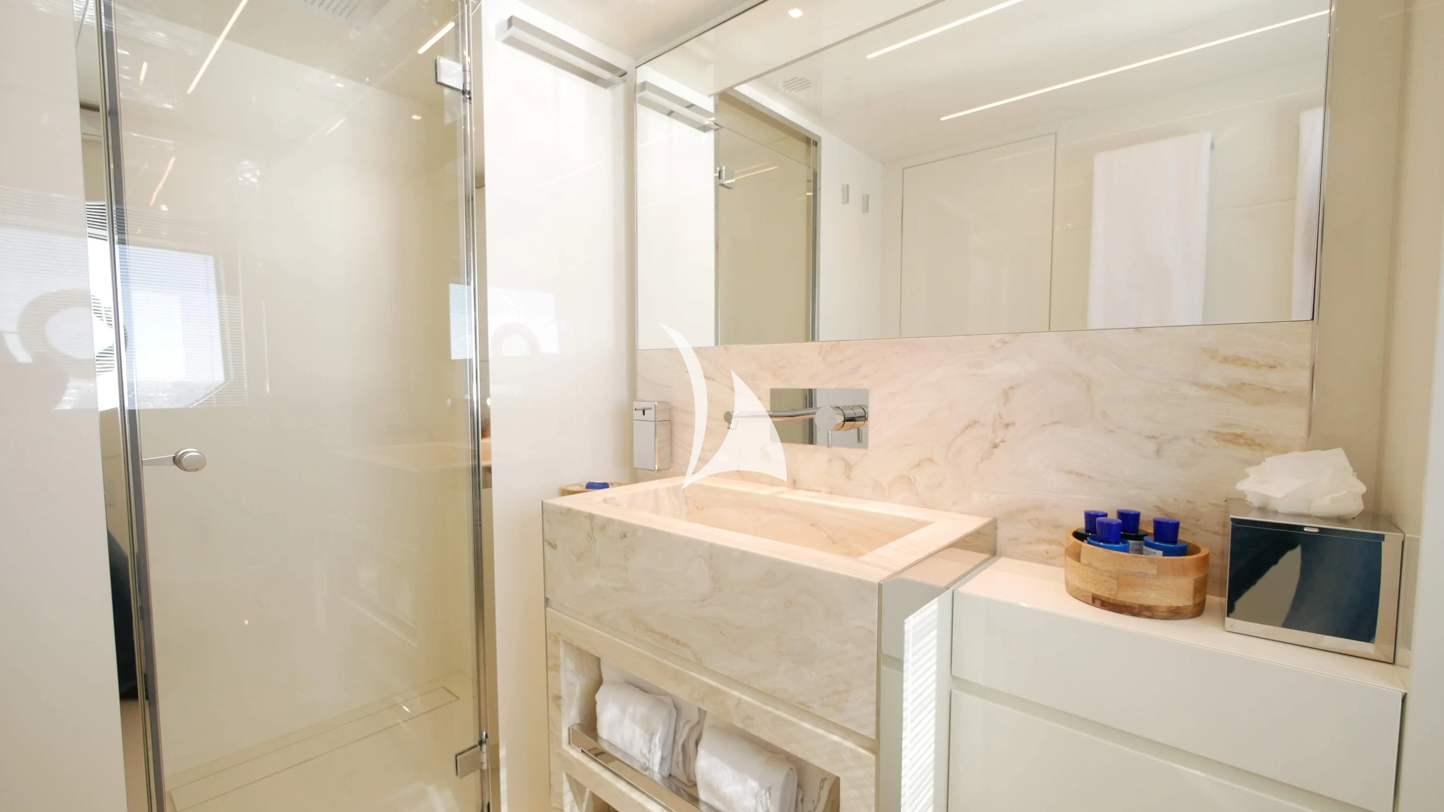a bathroom with a sink and a microwave aboard BASILIC Yacht for Sale