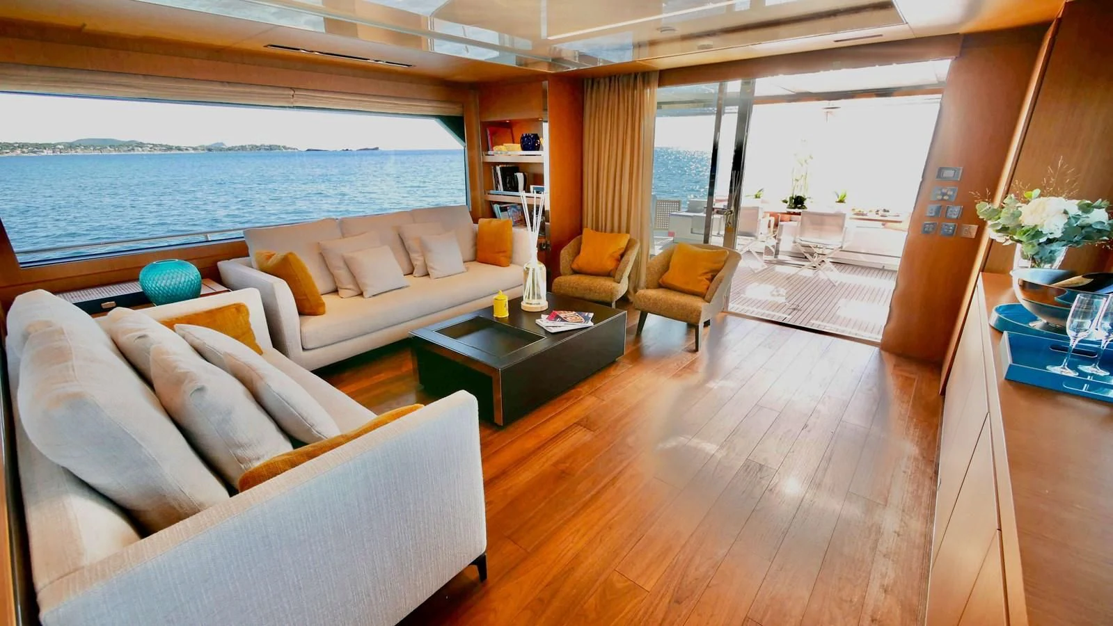 a living room with a large window aboard BASILIC Yacht for Sale