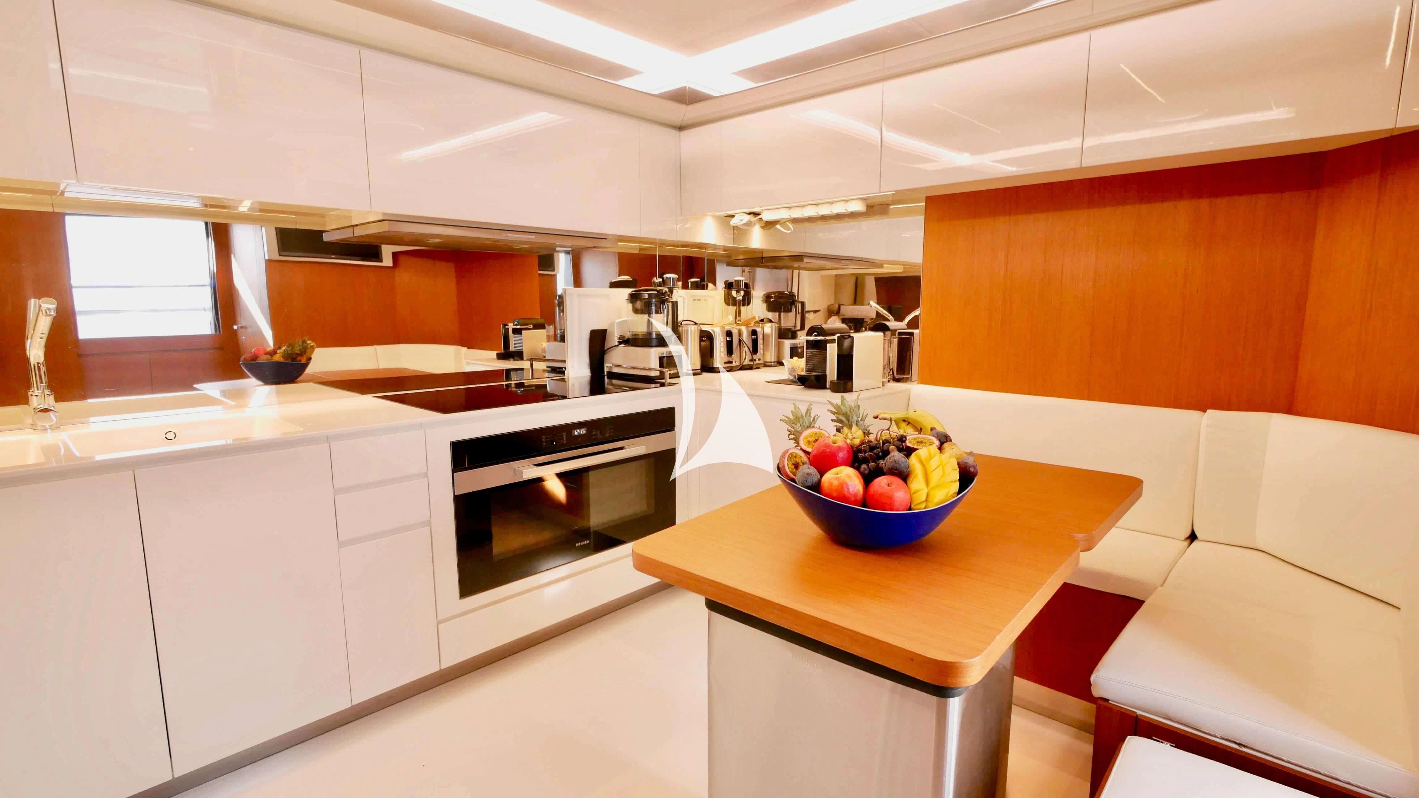 a bowl of fruit on a counter aboard BASILIC Yacht for Sale