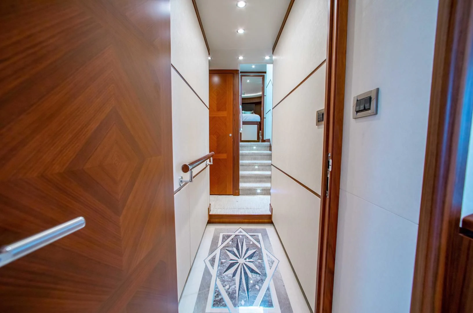 a hallway with a glass door aboard TRINITY Yacht for Sale