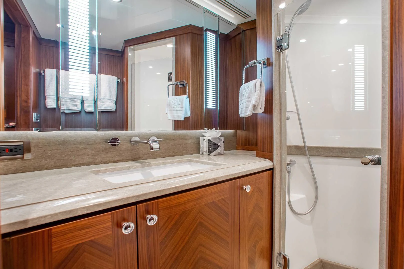 a bathroom with a large mirror aboard TRINITY Yacht for Sale