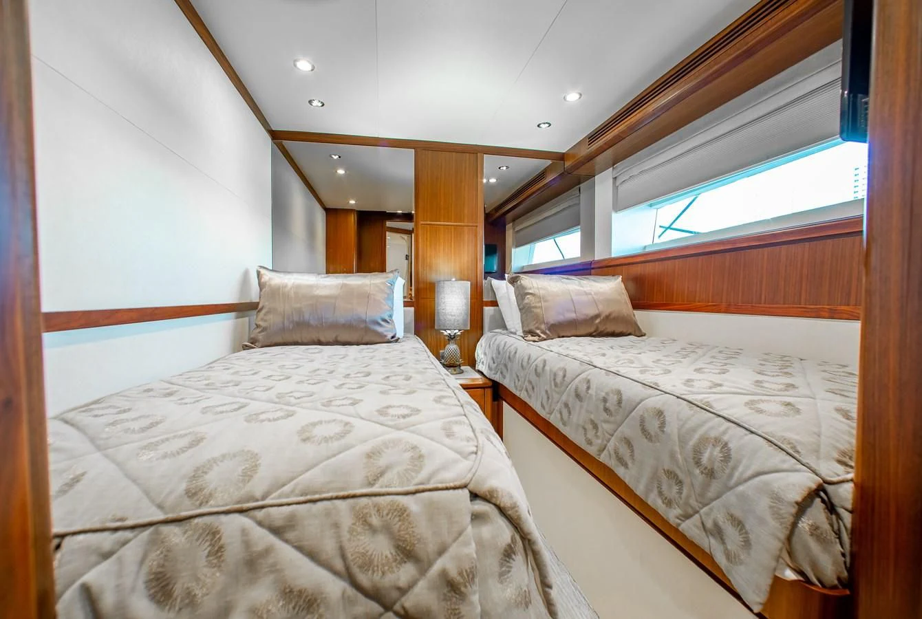 a couple of beds in a room aboard TRINITY Yacht for Sale