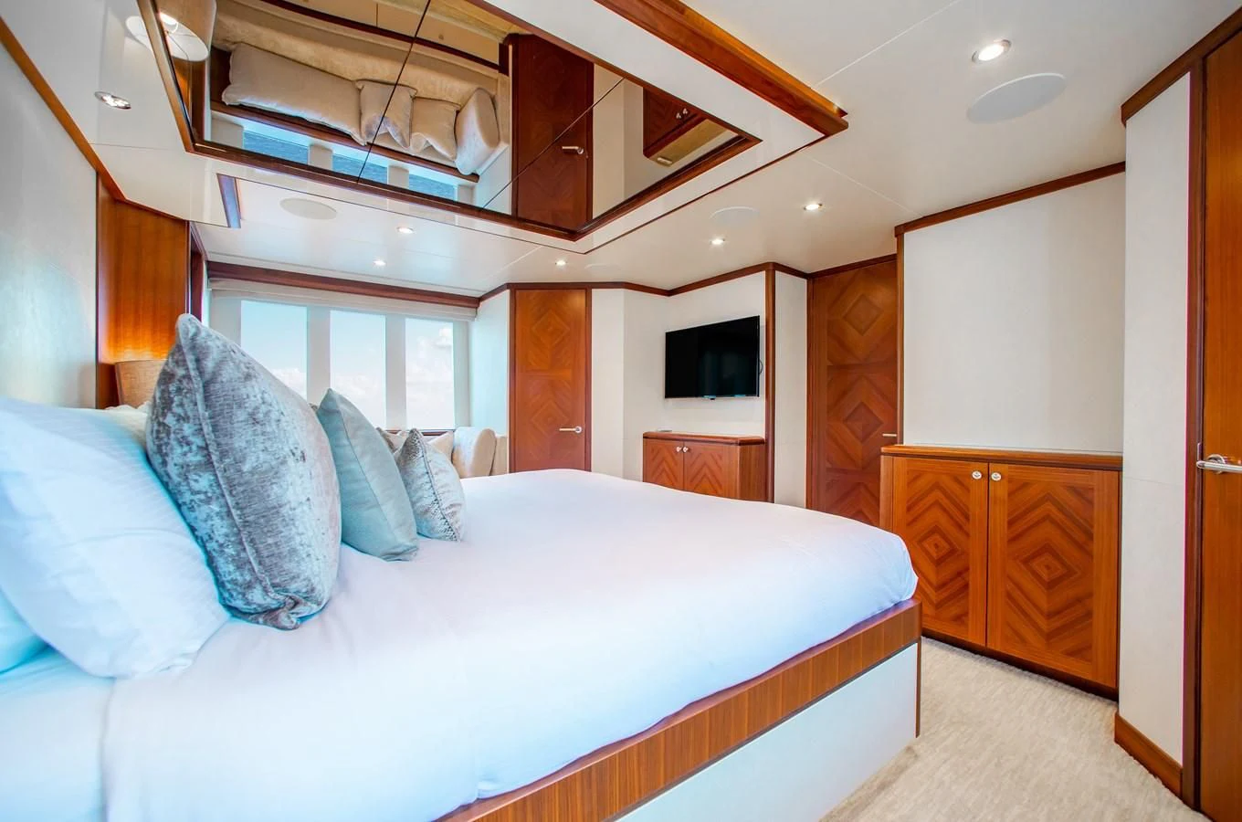 a bed in a room aboard TRINITY Yacht for Sale