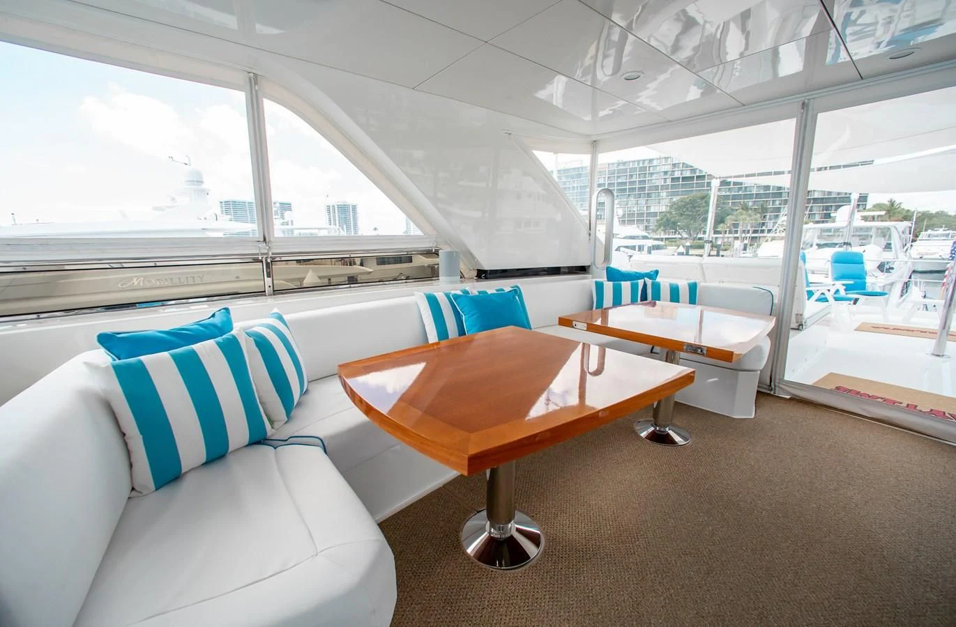 a room with a table and chairs aboard TRINITY Yacht for Sale