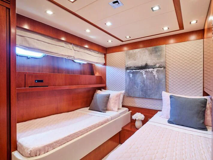a room with a bed and a window aboard BIANCA Yacht for Sale