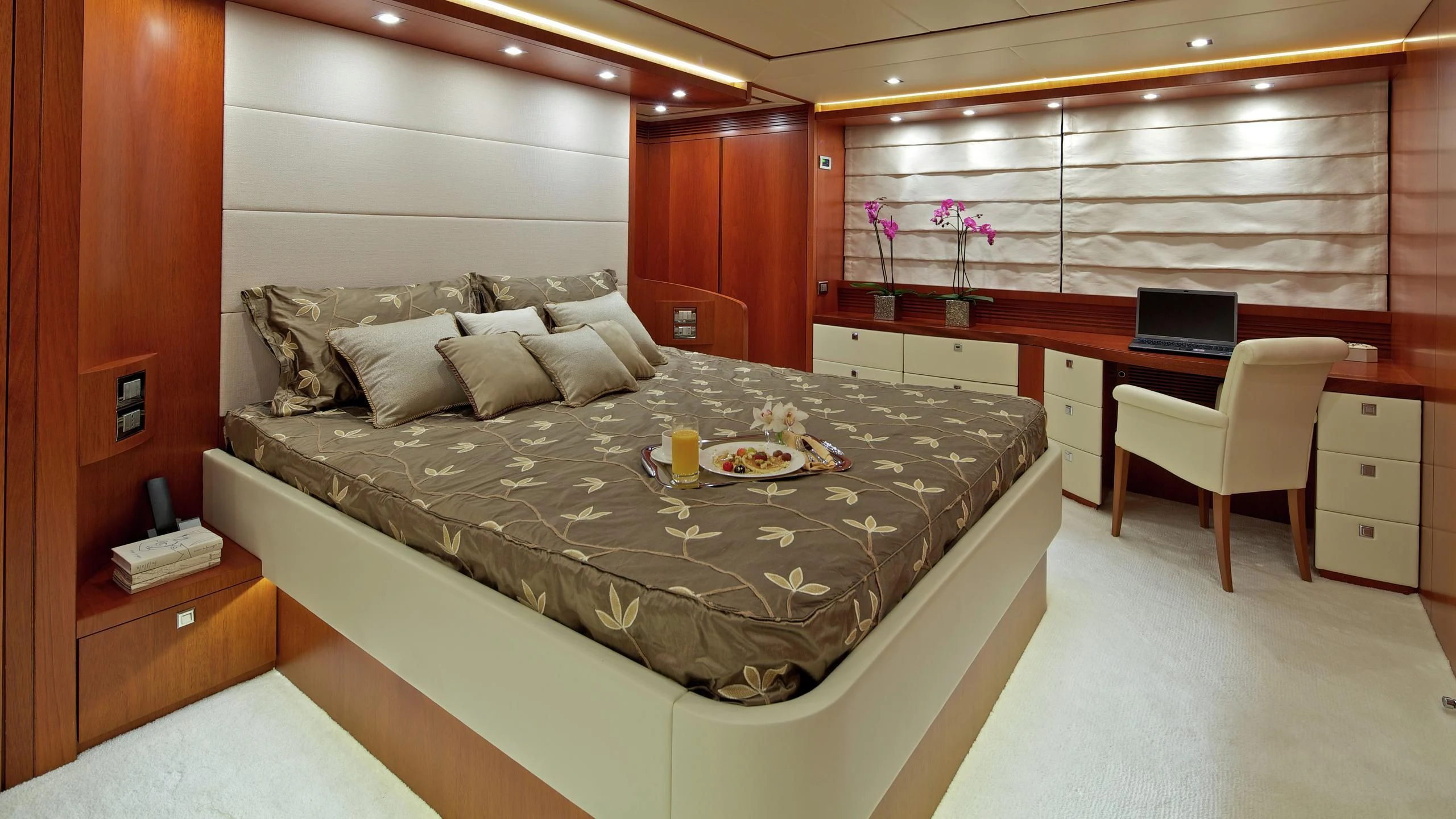 a bed with a laptop on it aboard BIANCA Yacht for Sale