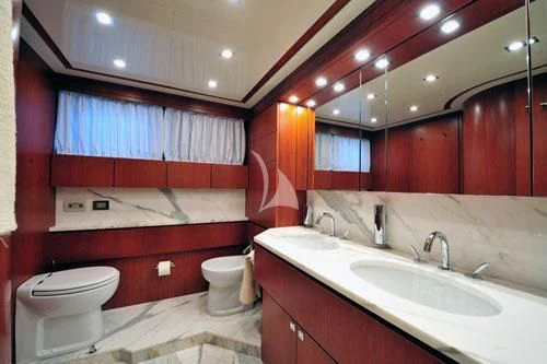 a bathroom with red cabinets aboard BIANCA Yacht for Sale