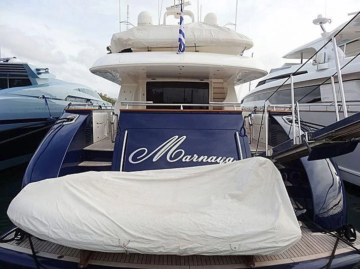 a boat with a blue and white stripe on it aboard BIANCA Yacht for Sale