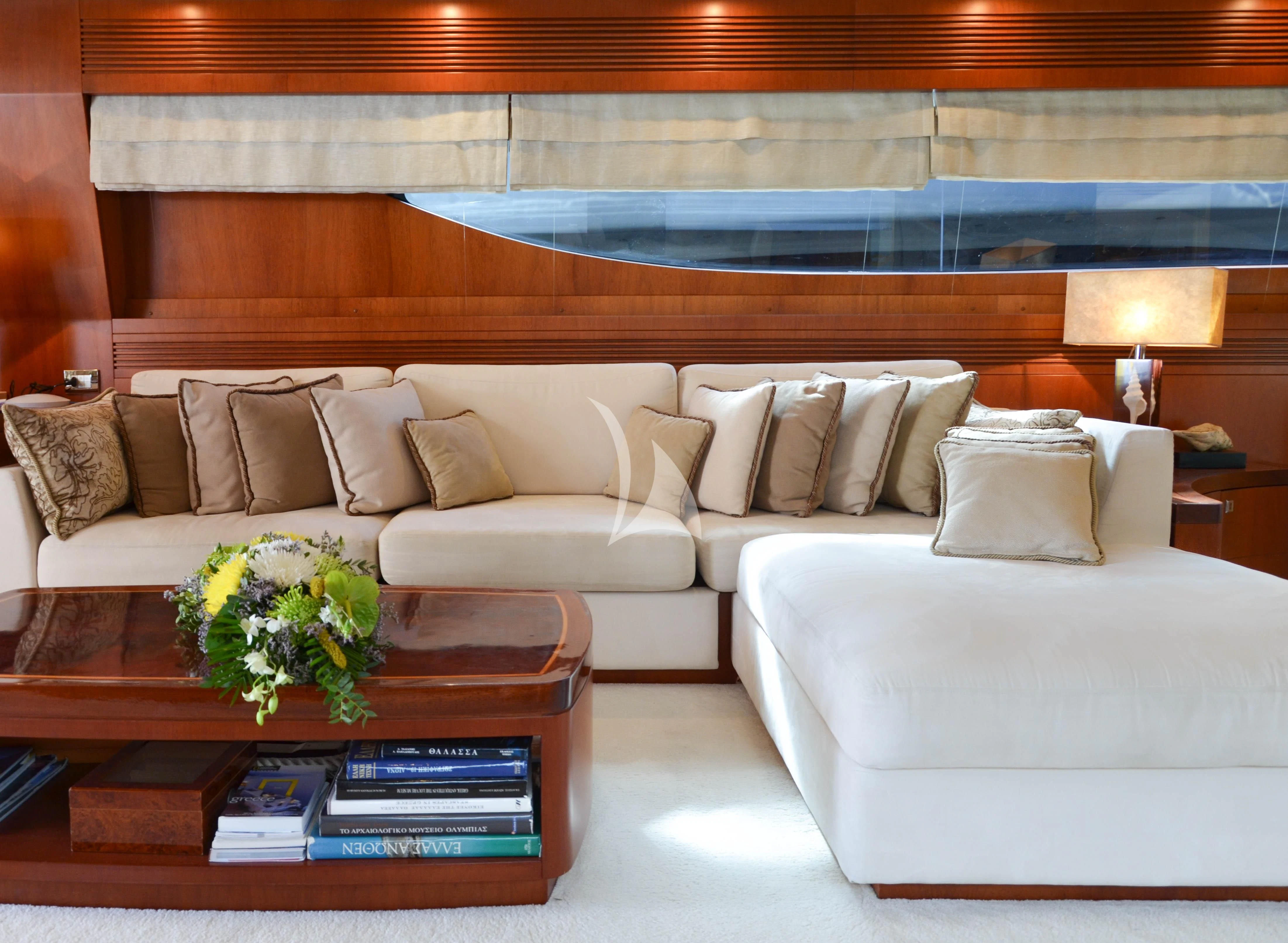 a living room with a couch and a coffee table aboard BIANCA Yacht for Sale