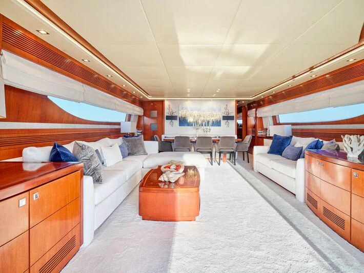 a bedroom with a bed and a table aboard BIANCA Yacht for Sale