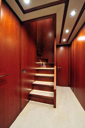 a wooden staircase in a room aboard BIANCA Yacht for Sale