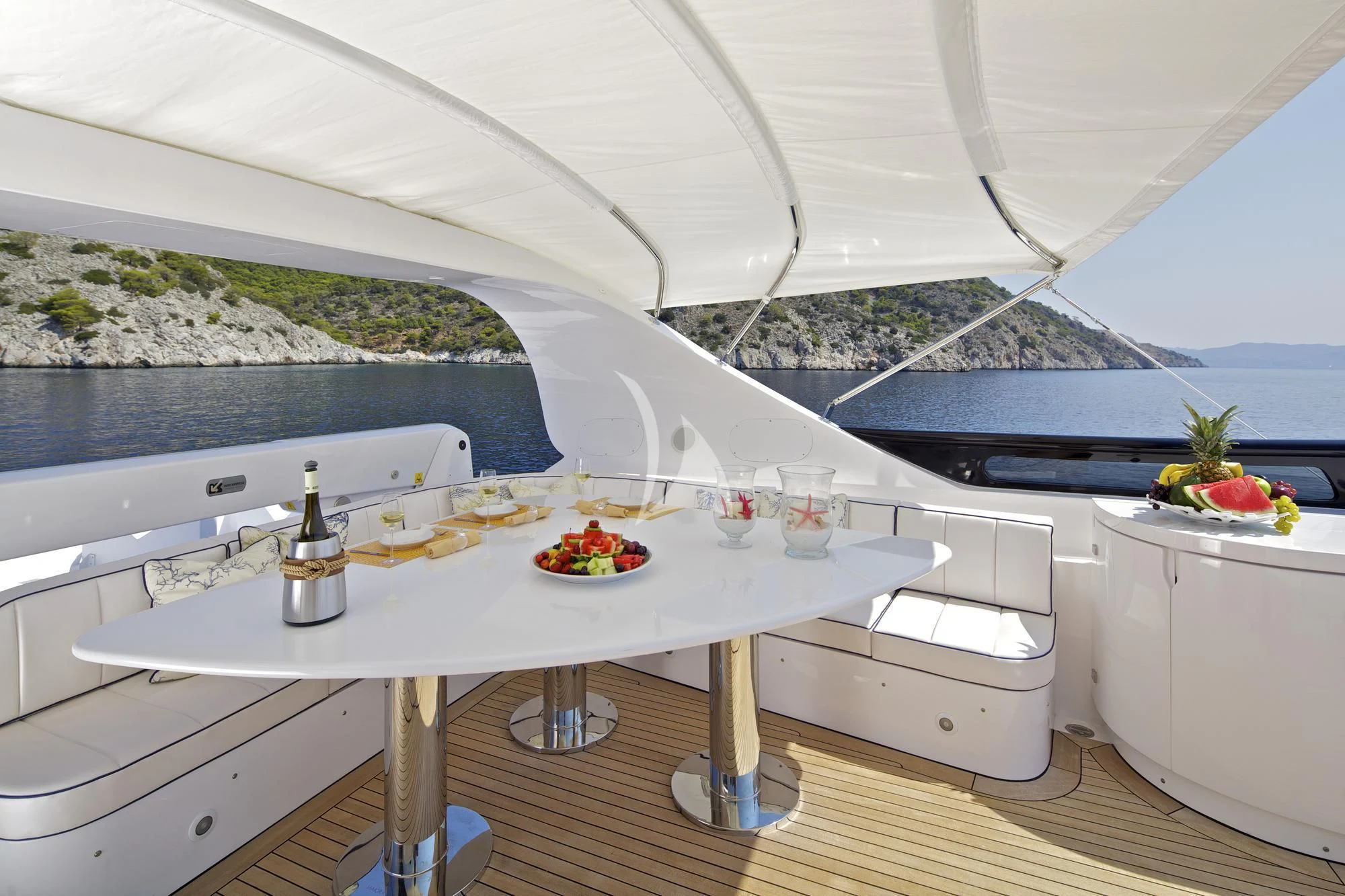 a table with food and drinks on it aboard BIANCA Yacht for Sale