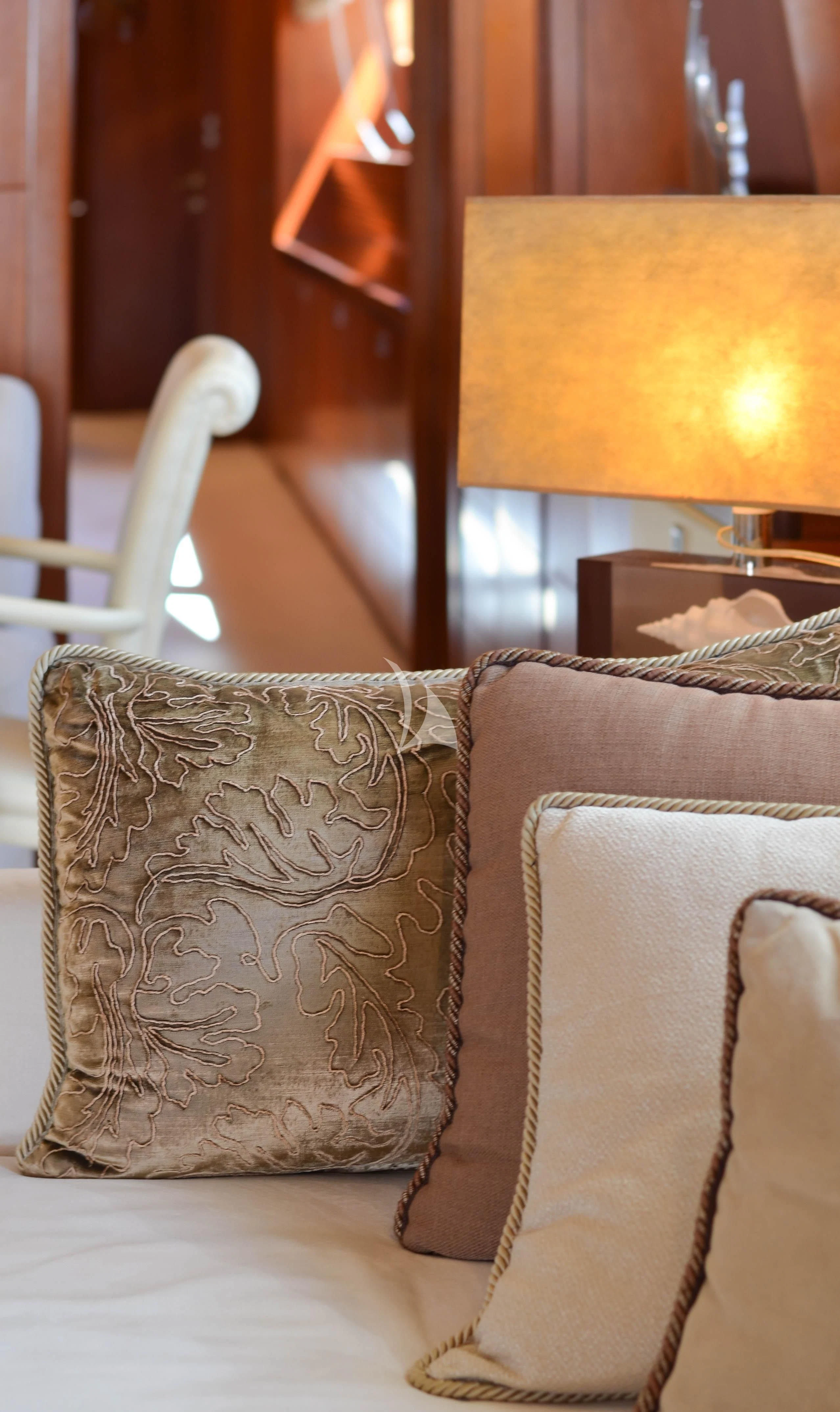 a couch with a pillow aboard BIANCA Yacht for Sale