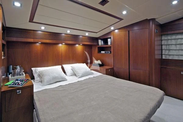 a bed with white sheets aboard BIANCA Yacht for Sale