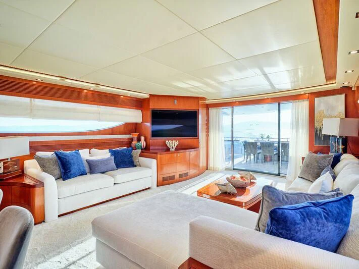 a living room with a couch and a television aboard BIANCA Yacht for Sale