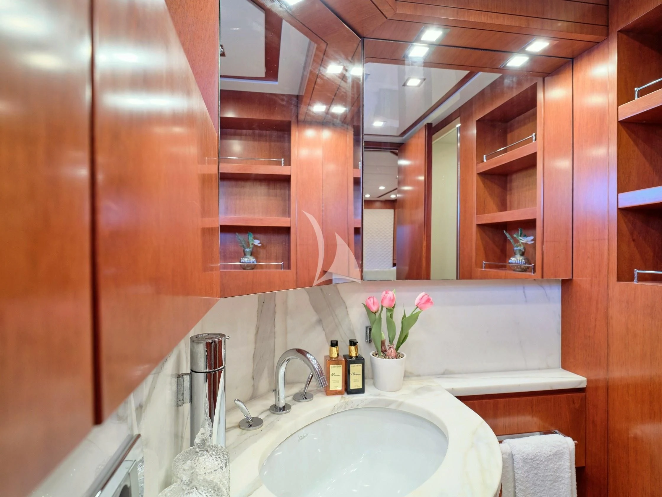 a bathroom with a sink and cabinets aboard BIANCA Yacht for Sale