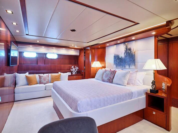 a room with a bed and a couch aboard BIANCA Yacht for Sale