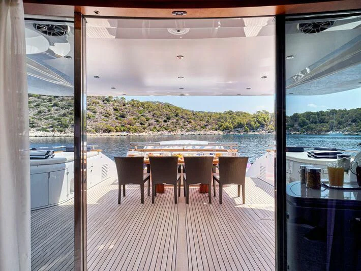 a room with a table and chairs aboard BIANCA Yacht for Sale
