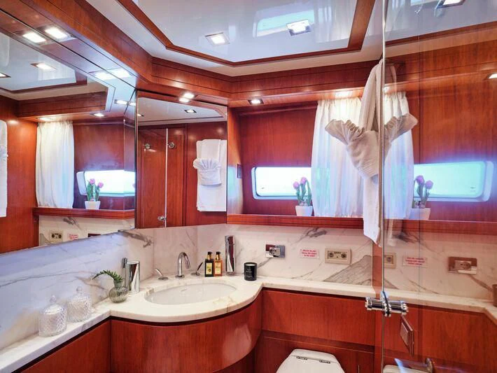 a bathroom with a sink and a mirror aboard BIANCA Yacht for Sale