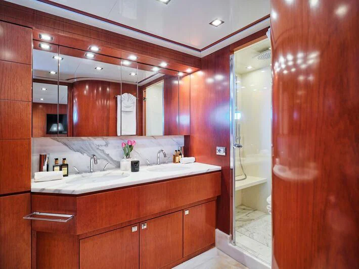 a bathroom with a large mirror aboard BIANCA Yacht for Sale
