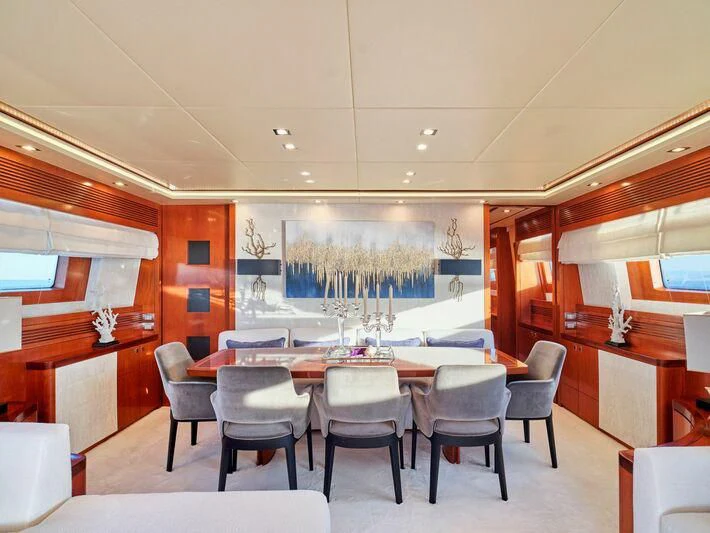 a room with a table and chairs aboard BIANCA Yacht for Sale