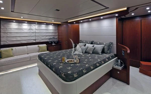 a room with a bed and a couch aboard BIANCA Yacht for Sale
