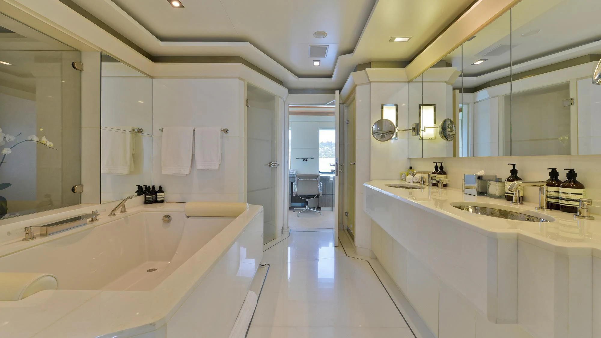 a bathroom with a large bathtub aboard TRIPLE SEVEN Yacht for Sale