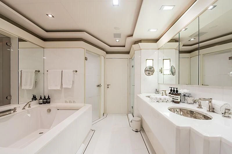 a bathroom with a large mirror aboard TRIPLE SEVEN Yacht for Sale