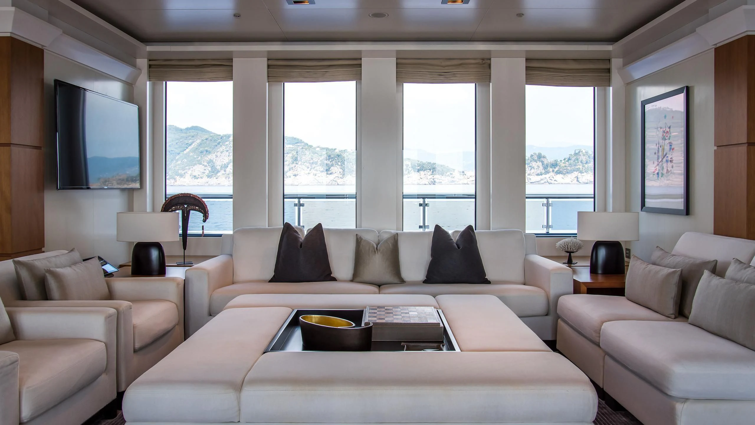a living room with a large window aboard TRIPLE SEVEN Yacht for Sale