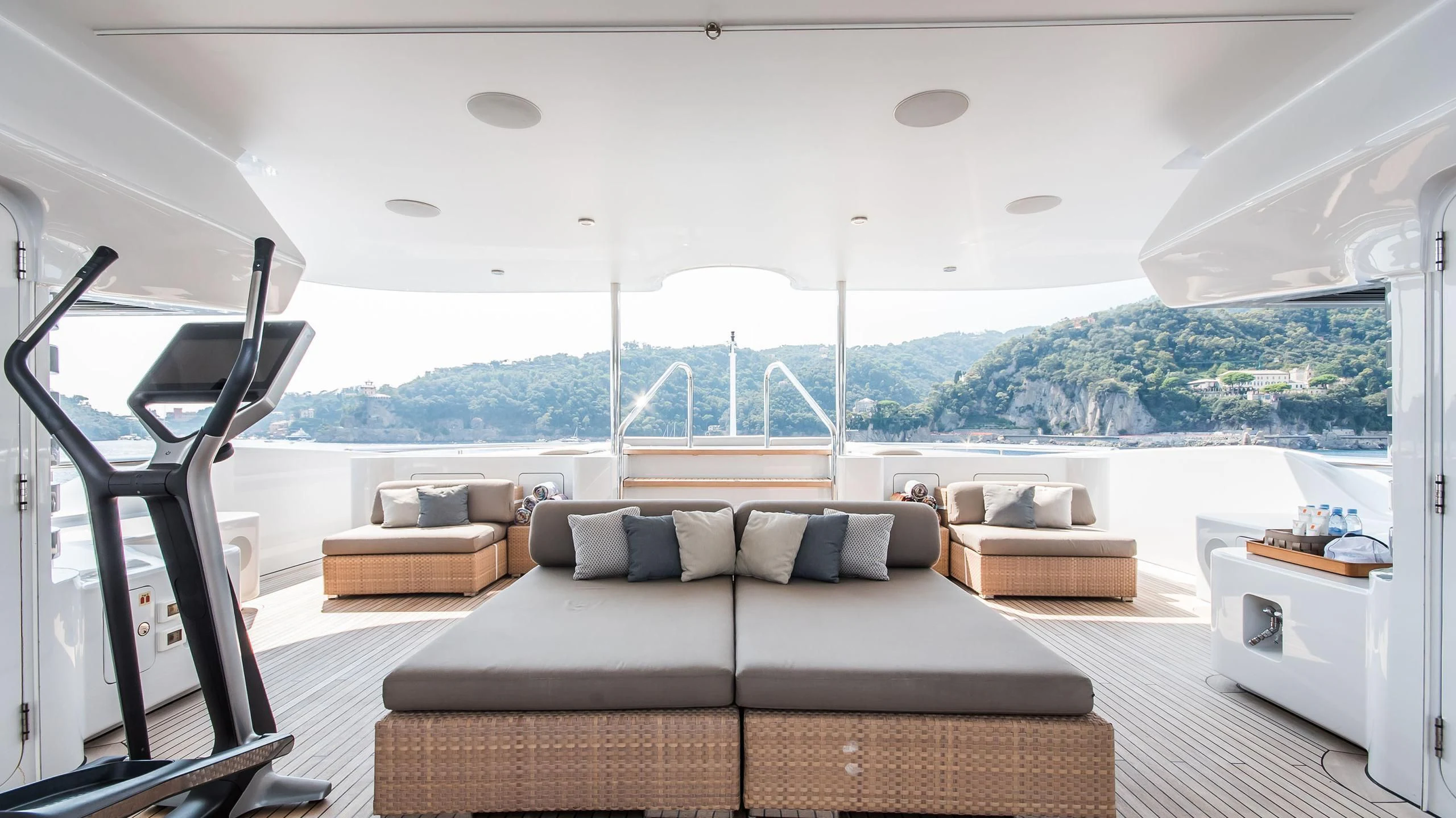 a room with a couch and a large window aboard TRIPLE SEVEN Yacht for Sale